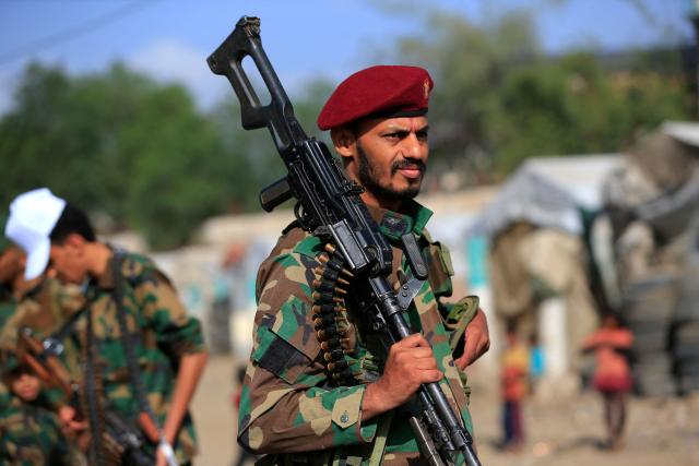 A Yemeni gunman brandishes his weapon during a rally to recruit more fighters in Sanaa on September 10, 2026. The country relapsed into war in July after years of calm, drawn into the regional conflict triggered by the US-Israeli offensive against Iran that began at the end of February. (Photo by Mohammed HUWAIS / AFP)