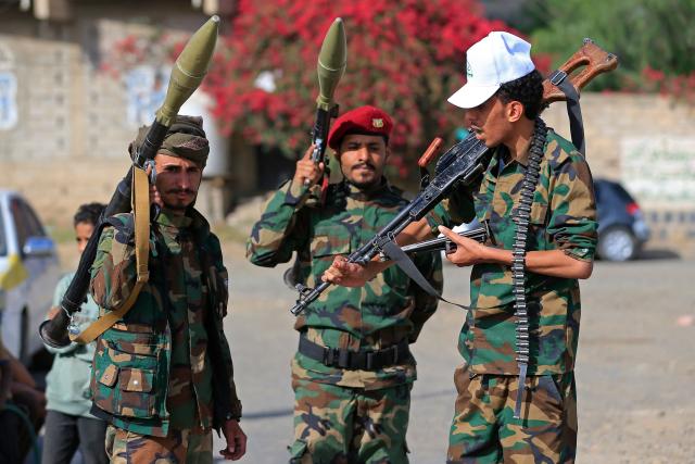 Yemeni gunmen brandish their weapons during a rally to recruit more fighters in Sanaa on September 10, 2026. The country relapsed into war in July after years of calm, drawn into the regional conflict triggered by the US-Israeli offensive against Iran that began at the end of February. (Photo by Mohammed HUWAIS / AFP)
