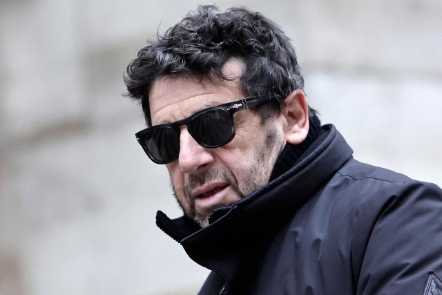 (FILES) French actor and singer Patrick Bruel arrives to attend the funeral ceremony of French-Danish actor Niels Arestrup outside the Church of Saint-Roch in Paris, on December 10, 2024. Bruel’s lawyers filed a complaint on September 9, 2026, specifically alleging a breach of the confidentiality of the investigation, condemning the publication by several media outlets, including *Paris Match*, of extracts from his interview with investigators, they told AFP on Thursday. (Photo by STEPHANE DE SAKUTIN / AFP)