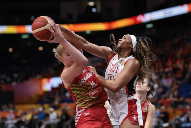 Hungary's power forward #14 Dorka Juhasz (L) and USA's forward #09 Kiki Iriafen vie for the ball during the 2026 FIBA Women's Basketball World Cup quarter-final match between USA and Hungary at the Berlin Arena in Berlin on September 10, 2026. (Photo by Ronny HARTMANN / AFP)