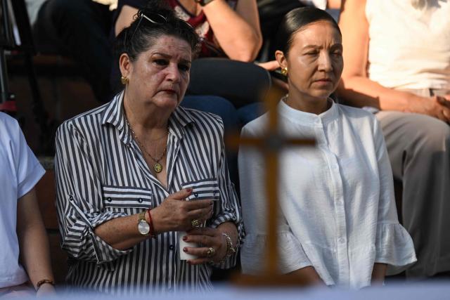 Relatives of the victims of the 7.4- magnitude earthquake take part in a ceremony in honor of the victims one month after the tragedy at Maria Inmaculada Church, near Torres del Limonar, in Cali, Colombia on September 10, 2026. (Photo by JOAQUIN SARMIENTO / AFP)