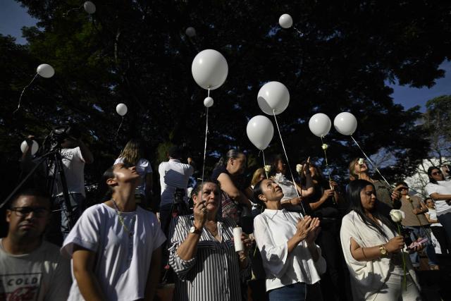 Relatives of the victims of the 7.4- magnitude earthquake take part in a ceremony in honor of the victims one month after the tragedy at Maria Inmaculada Church, near Torres del Limonar, in Cali, Colombia on September 10, 2026. (Photo by Joaquin SARMIENTO / AFP)