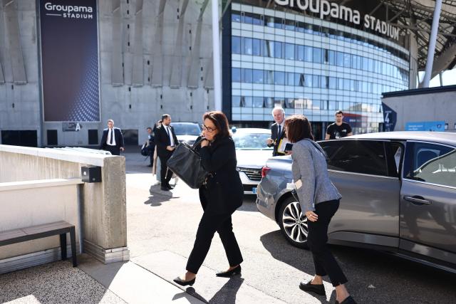 France's Sports Minister Marina Ferrari (C) and former Prime Minister Michel Barnier (R) arrive for a Alpes 2030 winter olympics executive board meeting in Decines-Charpieu, near Lyon, on September 10, 2026. (Photo by Alex MARTIN / AFP)