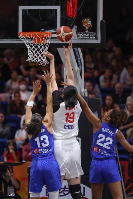 China's center #19 Zhang Ziyu (C) attempts to score during the 2026 FIBA Women's Basketball World Cup quarter-final match between China and France at the Berlin Arena in Berlin on September 10, 2026. (Photo by Ronny HARTMANN / AFP)