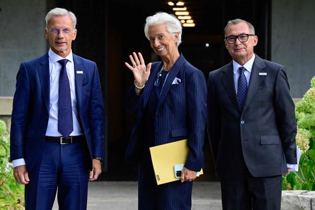 European Central Bank (ECB) President Christine Lagarde (C) waves as she and the German Central Bank's (Deutsche Bundesbank) President and member of the Governing Council of the ECB Joachim Nagel (R) and ECB Vice-President Boris Vujcic (L) leave following a press conference after a meeting of the Governing Council of the European Central Bank (ECB) in Berlin on September 10, 2026. The European Central Bank on September 10, 2026 lifted its growth projections for this year and next as the eurozone economy withstands the Iran war energy shock better than feared. (Photo by John MACDOUGALL / AFP)