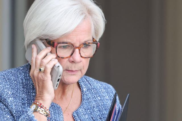 France's Defence Minister Catherine Vautrin uses her phone as she leaves after the weekly cabinet meeting at the Elysee Palace in Paris on September 10, 2026. (Photo by Ludovic MARIN / AFP)