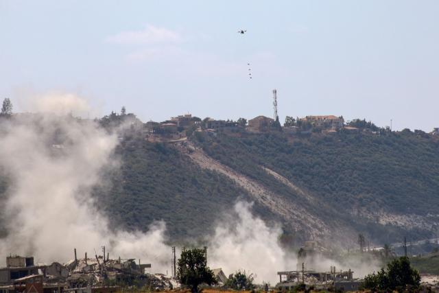This photograph taken from the southern Lebanese village of al-Haniyya shows an Israeli drone dropping explosive charges on a site at the village of al-Mansouri on September 10, 2026. (Photo by Kawnat HAJU / AFP) / 