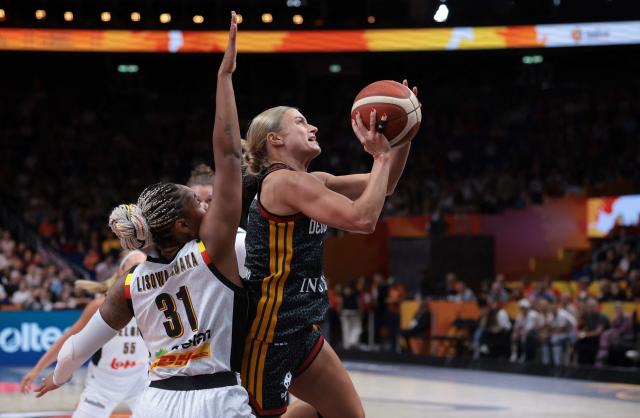 Germany's guard #03 Alexandra Wilke shoots past Belgium's small forward #31 Maxuella Lisowa Mbaka during the FIBA Women's Basketball World Cup quarter-final match between Belgium and Germany at the Berlin Arena in Berlin on September 10, 2026. (Photo by Ronny HARTMANN / AFP)