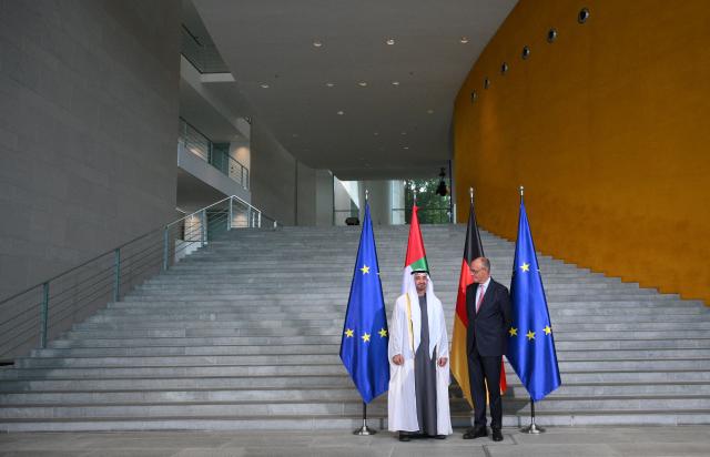 German Chancellor Friedrich Merz (R) poses next to UAE President Sheikh Mohamed bin Zayed Al-Nahyan at the Chancellery in Berlin on September 10, 2026. The leader of the United Arab Emirates is on a two-day-visit to Germany during which, Emirati diplomats said, AI and energy deals worth several billion euros will be signed. (Photo by RALF HIRSCHBERGER / AFP)