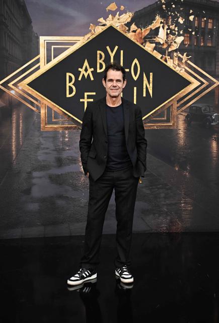 German film director and screenwriter Tom Tykwer poses on the red carpet for the premiere of the 'Babylon Berlin' TV series' last season at the Zoopalast cinema in Berlin, on September 10, 2026. The lavishly produced, big-budget ARD series is set against the backdrop of Hitler’s rise to power. (Photo by Tobias SCHWARZ / AFP)