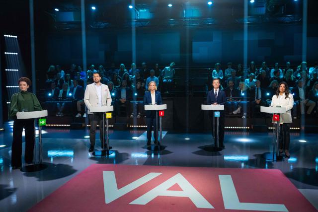 (L to R) Green Party spokespersons Amanda Lind, Sweden Democrats leader Jimmie Akesson, Social Democratic Party leader Magdalena Andersson, Swedish Prime Minister and Moderate Party leader Ulf Kristersson and Left Party leader Nooshi Dadgostar take part in a televised election debate hosted by TV4 in Stockholm, Sweden, on September 10, 2026, three days ahead of the country’s general election. (Photo by Jonathan NACKSTRAND / AFP)