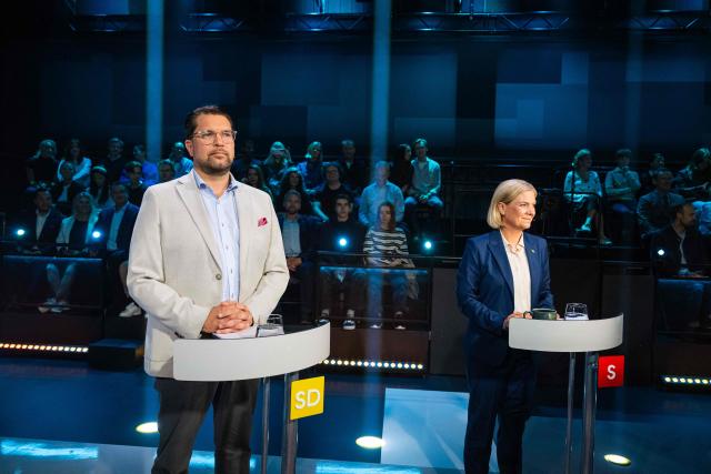 Sweden Democrats leader Jimmie Akesson (L) and Social Democratic Party leader Magdalena Andersson take part in a televised election debate hosted by TV4 in Stockholm, Sweden, on September 10, 2026, three days ahead of the country’s general election. (Photo by Jonathan NACKSTRAND / AFP)