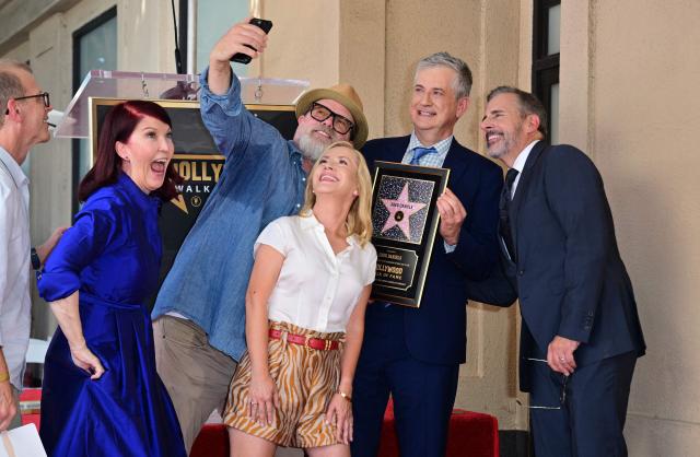 (L-R) Actors Kate Flannery, Rainn Wilson, Angela Kinsey, and Steve Carell (R) pose for a selfie with screenwriter and television producer Greg Daniels (2R) during his Hollywood Walk of Fame star ceremony in the Hollywood neighborhood of Los Angeles on September 10, 2026. (Photo by Frederic J. BROWN / AFP)
