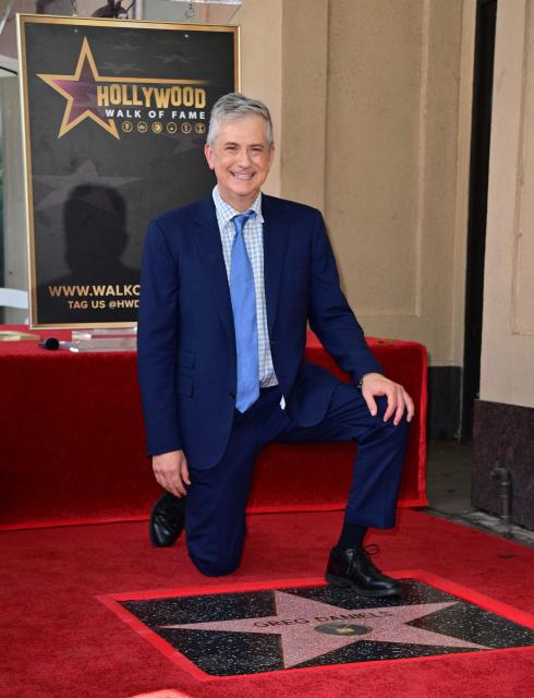 Screenwriter and television producer Greg Daniels poses on his newly unveilled Hollywood Walk of Fame star during the ceremony in the Hollywood neighborhood of Los Angeles on September 10, 2026. (Photo by Frederic J. BROWN / AFP)