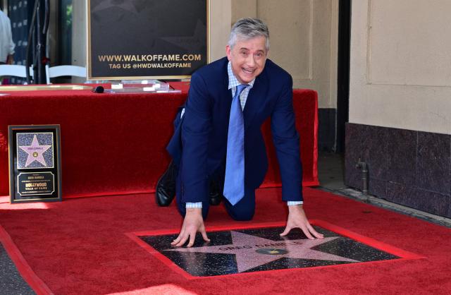 Screenwriter and television producer Greg Daniels poses on his newly unveilled Hollywood Walk of Fame star during the ceremony in the Hollywood neighborhood of Los Angeles on September 10, 2026. (Photo by Frederic J. BROWN / AFP)