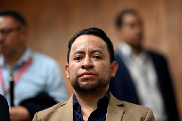 Mayan leader and Deputy Minister of Energy and Mines Luis Pacheco waits for the start of a hearing to decide whether indigenous leaders accused of terrorism should face trial for protests in 2023, at the Justice Palace in Guatemala City on September 10, 2026. (Photo by Johan ORDONEZ / AFP)