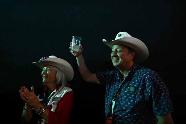 Attendees from Texas watch the proceedings during the second day of the Republican National Committee midterm convention at the American Airlines Center in Dallas, Texas on September 10, 2026. US Republicans are betting that putting President Donald Trump at the center of their campaign can rescue a party facing grim election forecasts, despite the president's negative approval ratings. A day earlier, on the first day of the midterm convention, he promised $5,000 to every American adult if Republicans retain control of Congress in November. (Photo by Kent NISHIMURA / AFP)