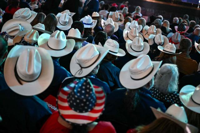 Attendees from Texas watch the proceedings during the second day of the Republican National Committee midterm convention at the American Airlines Center in Dallas, Texas on September 10, 2026. US Republicans are betting that putting President Donald Trump at the center of their campaign can rescue a party facing grim election forecasts, despite the president's negative approval ratings. A day earlier, on the first day of the midterm convention, he promised $5,000 to every American adult if Republicans retain control of Congress in November. (Photo by Kent NISHIMURA / AFP)