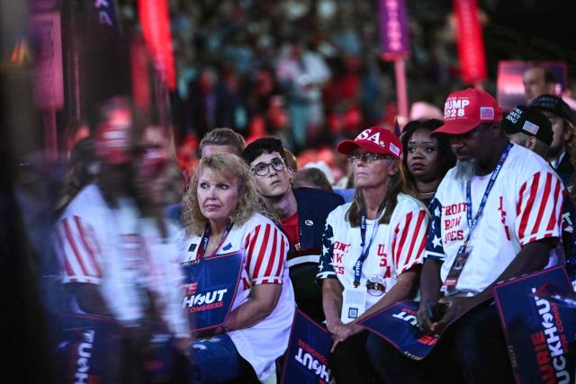 Attendees watch the proceedings during the second day of the Republican National Committee midterm convention at the American Airlines Center in Dallas, Texas on September 10, 2026. US Republicans are betting that putting President Donald Trump at the center of their campaign can rescue a party facing grim election forecasts, despite the president's negative approval ratings. A day earlier, on the first day of the midterm convention, he promised $5,000 to every American adult if Republicans retain control of Congress in November. (Photo by Kent NISHIMURA / AFP)