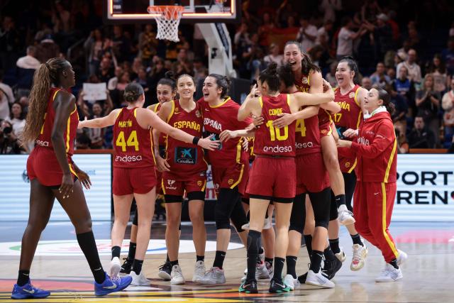 Spain's players celebrate their victory in the 2026 FIBA Women's Basketball World Cup quarter-final match between Australia and Spain at the Berlin Arena in Berlin on September 10, 2026. (Photo by Ronny HARTMANN / AFP)