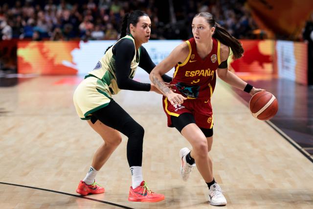 Australia's shooting guard #04 Alex Wilson and Spain's small forward #09 Helena Pueyo (R) vie for the ball during the 2026 FIBA Women's Basketball World Cup quarter-final match between Australia and Spain at the Berlin Arena in Berlin on September 10, 2026. (Photo by Ronny HARTMANN / AFP)