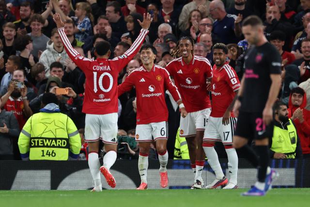 Manchester United's Argentinian defender #06 Lisandro Martinez (C) celebrates scoring the team's fourth goal during the UEFA Champions League football match between Manchester United and Sabah FK at Old Trafford in Manchester, north west England, on September 10, 2026. (Photo by Darren Staples / AFP)