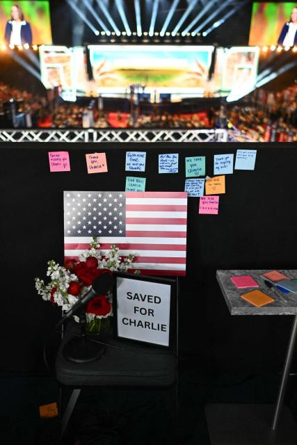 Notes and flowers are left for slain activist Charlie Kirk, on the first anniversary of Kirk's assassination, during the second day of the Republican National Committee midterm convention at the American Airlines Center in Dallas, Texas on September 10, 2026. US Republicans are betting that putting President Donald Trump at the center of their campaign can rescue a party facing grim election forecasts, despite the president's negative approval ratings. A day earlier, on the first day of the midterm convention, he promised $5,000 to every American adult if Republicans retain control of Congress in November. (Photo by Kent NISHIMURA / AFP)