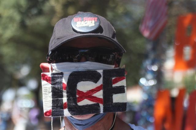 Anti-Trump protestors demonstrate outside the Republican National Committee midterm convention at the American Airlines Center in Dallas, Texas on September 10, 2026. US Republicans are betting that putting President Donald Trump at the center of their campaign can rescue a party facing grim election forecasts, despite the president's negative approval ratings. A day earlier, on the first day of the midterm convention, he promised $5,000 to every American adult if Republicans retain control of Congress in November. (Photo by Blake Fagan / AFP)