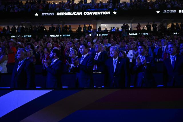 US Representative Mike Lawler (2L), Republican from New York, stands with Medal of Honor recipients as a video about the 9/11 attacks is played during the second day of the Republican National Committee midterm convention at the American Airlines Center in Dallas, Texas on September 10, 2026. US Republicans are betting that putting President Donald Trump at the center of their campaign can rescue a party facing grim election forecasts, despite the president's negative approval ratings. A day earlier, on the first day of the midterm convention, he promised $5,000 to every American adult if Republicans retain control of Congress in November. (Photo by Brendan SMIALOWSKI / AFP)