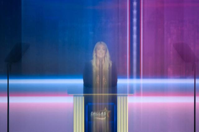 Former White House Press Secretary Karoline Leavitt speaks during the second day of the Republican National Committee midterm convention at the American Airlines Center in Dallas, Texas on September 10, 2026, captured with a slow shutter speed. US Republicans are betting that putting President Donald Trump at the center of their campaign can rescue a party facing grim election forecasts, despite the president's negative approval ratings. A day earlier, on the first day of the midterm convention, he promised $5,000 to every American adult if Republicans retain control of Congress in November. (Photo by Patrick T. Fallon / AFP)