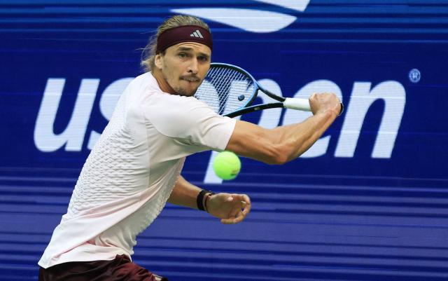 Germany's Alexander Zverev returns the ball to Russia's Karen Khachanov during the men's singles semi-final tennis match on day thirteen of the US Open tennis tournament at the USTA Billie Jean King National Tennis Center in New York City on September 11, 2026. (Photo by TIMOTHY A. CLARY / AFP)
