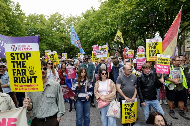 People take part in an anti-far right demonstration in the city of Portsmouth, southern England on September 12, 2026. Protesters at planned anti-immigration and counter-demonstration rallies in southern England were expected to be banned from wearing face masks, police said on September 11, amid fears of unrest. (Photo by Brook Mitchell / AFP)