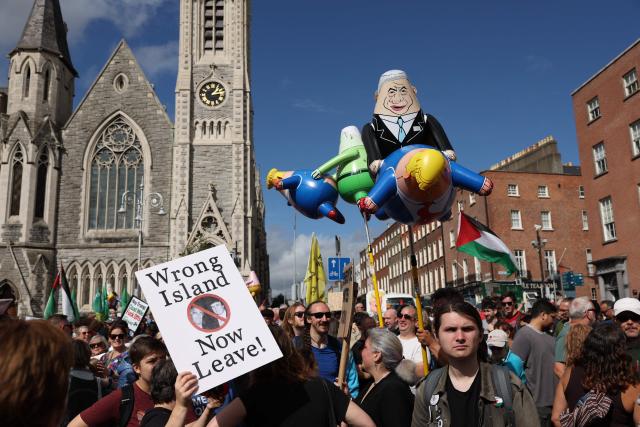 People take part in a protest against the visit of US President Donald Trump in the Irish capital Dublin on September 12, 2026. Trump arrived in Ireland on September 12 for a two-day visit, stopping for a few hours in Dublin before heading west to his Trump International Golf Links to attend the Irish Open. (Photo by Adrian Dennis / AFP)