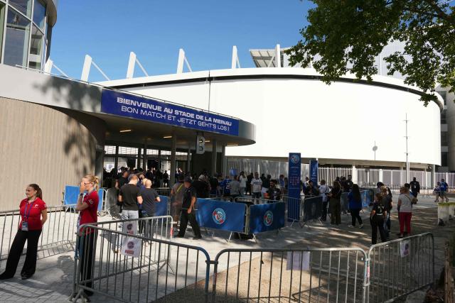 Football fans arrive at the stadium prior to the French L1 football match between RC Strasbourg Alsace and AS Monaco at the Stade de la Meinau in Strasbourg, eastern France, on September 12, 2026. (Photo by SEBASTIEN BOZON / AFP)