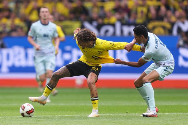 Dortmund's Portuguese forward #21 Fabio Silva and Paderborn's US midfielder #05 Santiago Castaneda vie for the ball during the German first division Bundesliga football match between Borussia Dortmund and SC Paderborn in Dortmund on September 12, 2026. (Photo by Leon Kuegeler / AFP) / DFL REGULATIONS PROHIBIT ANY USE OF PHOTOGRAPHS AS IMAGE SEQUENCES AND/OR QUASI-VIDEO