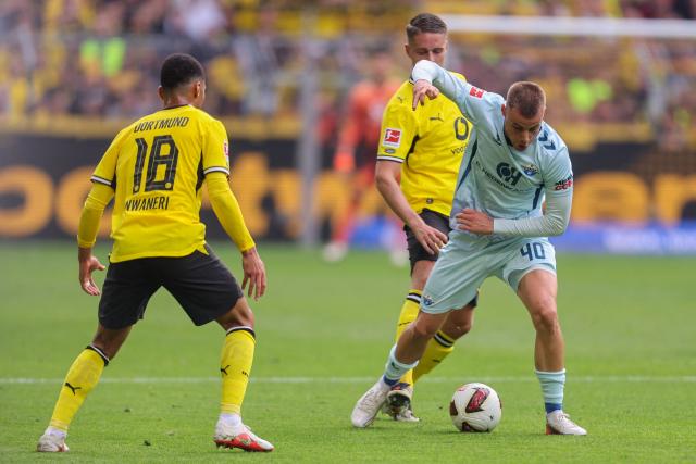 Paderborn's German-Croatian forward #40 Gabriel Vidovic vies for the ball with Dortmund's Dutch midfielder #25 Joey Veerman and Dortmund's English forward #18 Ethan Nwaneriduring the German first division Bundesliga football match between Borussia Dortmund and SC Paderborn in Dortmund on September 12, 2026. (Photo by Leon Kuegeler / AFP) / DFL REGULATIONS PROHIBIT ANY USE OF PHOTOGRAPHS AS IMAGE SEQUENCES AND/OR QUASI-VIDEO