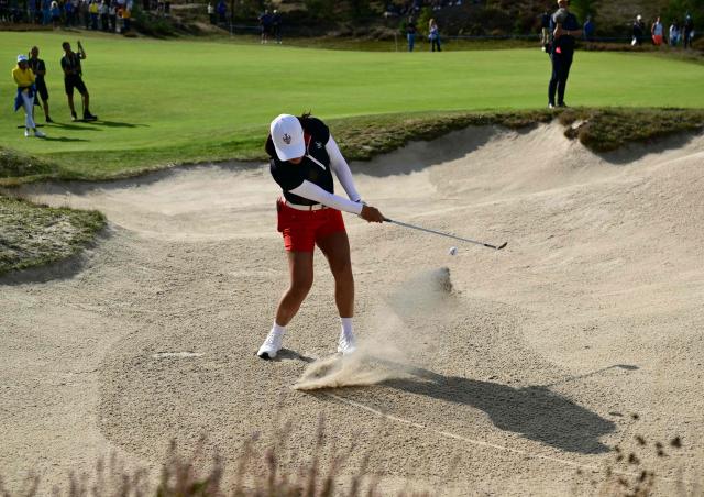 US teams golfer Auston Kim hits out of a bunker during play in her fourball match against Team Europe players on the second day of the 2026 Solheim Cup biennial team golf competition on The Bernardus Golf Course at Cromvoirt, some 80kms south-east of Rotterdam on September 12, 2026. (Photo by NICOLAS TUCAT / AFP)