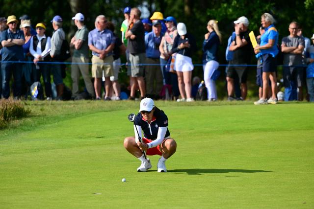 US teams golfer Auston Kim lines up a putt during play in her fourball match against Team Europe players on the second day of the 2026 Solheim Cup biennial team golf competition on The Bernardus Golf Course at Cromvoirt, some 80kms south-east of Rotterdam on September 12, 2026. (Photo by NICOLAS TUCAT / AFP)