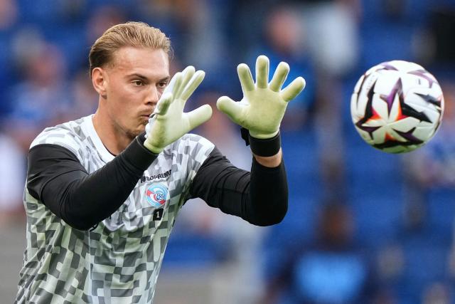 Strasbourg's Danish goalkeeper #01 Filip Jorgensen grabs the ball during a warm up session ahead of the French L1 football match between RC Strasbourg Alsace and AS Monaco at the Stade de la Meinau in Strasbourg, eastern France, on September 12, 2026. (Photo by SEBASTIEN BOZON / AFP)