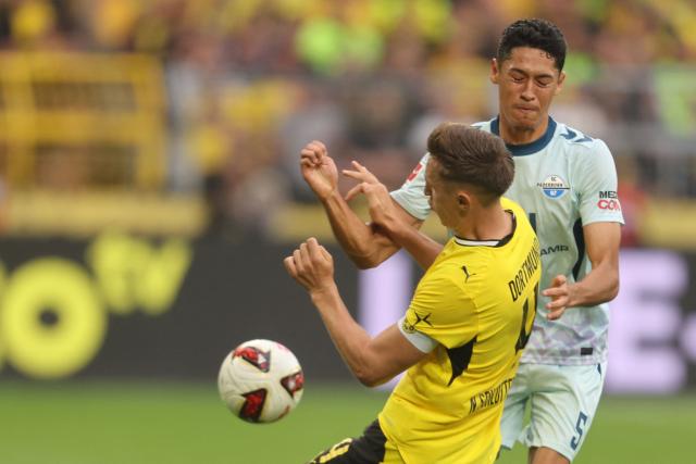Dortmund's German defender #04 Nico Schlotterbeck and Paderborn's US midfielder #05 Santiago Castaneda vie for the ball during the German first division Bundesliga football match between Borussia Dortmund and SC Paderborn in Dortmund on September 12, 2026. (Photo by Leon Kuegeler / AFP) / DFL REGULATIONS PROHIBIT ANY USE OF PHOTOGRAPHS AS IMAGE SEQUENCES AND/OR QUASI-VIDEO
