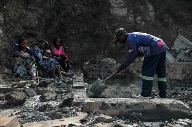 A man clears debris at the site of the blaze in Bukavu, Democratic Republic of the Congo, on September 12, 2026. A fire and stampede at a school in the eastern Democratic Republic of Congo killed at least 26 children, the UN children's agency said on Friday, with some pupils leaping from windows on high floors to escape the carnage.
The blaze in the city of Bukavu on Thursday began around 9:00 am (0700 GMT) while the children were in lessons, forcing some to try to escape by jumping from higher floors, a teacher told AFP. (Photo by Jospin Mwisha / AFP)
