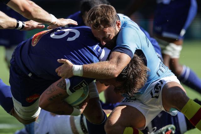 Castres' French flanker Baptiste Delaporte (L) is tackled during the French Top14 rugby union match between USA Perpignan and Castres Oympique at the Aime-Giral stadium in Perpignan, south-western France on September 12, 2026. (Photo by Valentine CHAPUIS / AFP)
