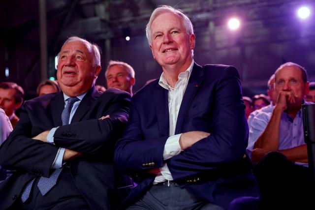 President of the French Senate Gerard Larcher (L) and Former French Prime Minister Michel Barnier react during the meeting of President of French right-wing party Les Republicains (LR) and candidate for France’s 2027 presidential election Bruno Retailleau in Nogent-sur-Marne, east of Paris, on September 12, 2026. (Photo by Ian LANGSDON / AFP)