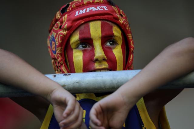 A young Perpignan supporter looks on from the stands ahead of the French Top14 rugby union match between USA Perpignan and Castres Oympique at the Aime-Giral stadium in Perpignan, south-western France on September 12, 2026. (Photo by Valentine CHAPUIS / AFP)