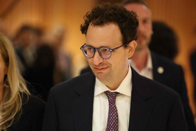 (FILES) Anthropic CEO Dario Amodei looks on after a meeting with French President Emmanuel Macron during the AI Impact Summit in New Delhi on February 19, 2026. Anthropic CEO Dario Amodei on September 12, 2026, called on artificial intelligence (AI) firms to slow down the development of the powerful technology, amid mounting worries over the risks of "superintelligent" computer systems. His comments came a few days after AI researcher Jacob Coxon, who left OpenAI to join Anthropic, decided to leave the industry, accusing both US companies of "gambling with our lives" in the race to develop models capable of self-improvement. (Photo by Ludovic MARIN / AFP)