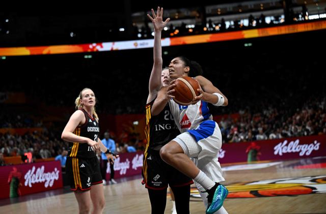 Germany's power forward #20 Frieda Buhner and France's forward #13 Janelle Salaun vie for the ball during the 2026 FIBA Women's Basketball World Cup semi-final match between France and Germany in Berlin on September 12, 2026. (Photo by Tobias SCHWARZ / AFP)