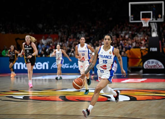 France's forward #15 Gabby Williams plays the ball during the 2026 FIBA Women's Basketball World Cup semi-final match between France and Germany in Berlin on September 12, 2026. (Photo by Tobias SCHWARZ / AFP)