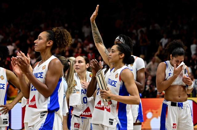 France's team celebrates at the end of the 2026 FIBA Women's Basketball World Cup semi-final match between France and Germany in Berlin on September 12, 2026. (Photo by Tobias SCHWARZ / AFP)