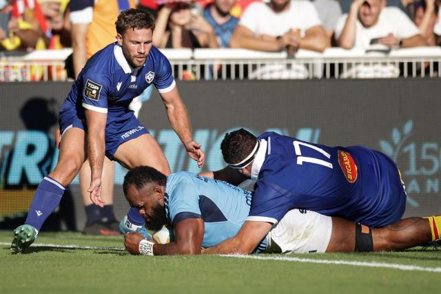 Perpignan's Fijian lock Peceli Yato (C) scores a try during the French Top14 rugby union match between USA Perpignan and Castres Oympique at the Aime-Giral stadium in Perpignan, south-western France on September 12, 2026. (Photo by Valentine CHAPUIS / AFP)