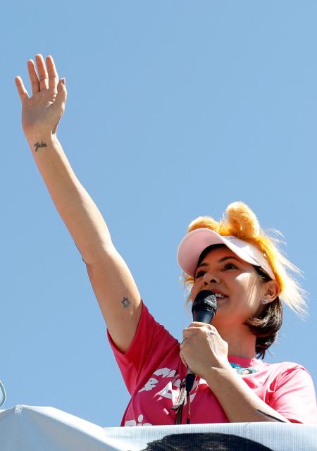 Brazil's former First Lady and candidate for the Federal Senate for the Liberal Party (PL), Michelle Bolsonaro, waves during a motorcade in Ceilandia, an administrative region of Brasilia's Federal District, on September 12, 2026. Michelle Bolsonaro backs her stepson, Flavio Bolsonaro, for the upcoming October 4 presidential election. (Photo by Sergio Lima / AFP)